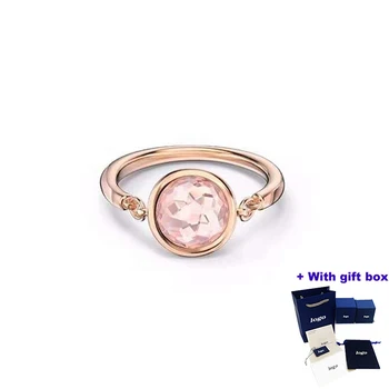 Модерен и очарователен пръстен с инкрустиран от розов кристал, подходящи за носене на красиви жени, като подчертава елегантността и благородството на